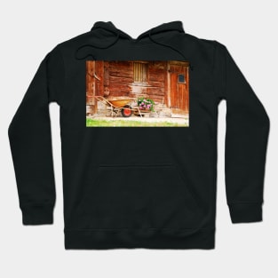 Rusted Wheelbarrow in Front of Wooden Farm House Hoodie